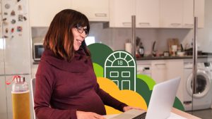 Real estate investor working on laptop in kitchen with Left Main REI branding in background
