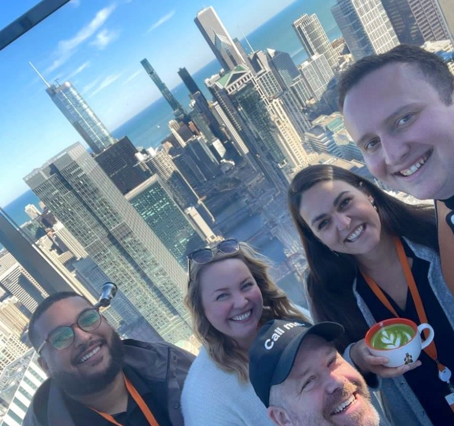 Left Main REI and smrtPhone teams celebrating at the Salesforce Tower together in Chicago