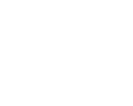 White laptop icon with speech bubble next to it representing communication and collaboration